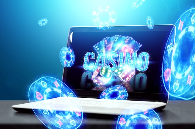 Concept for online casino, gambling, online money games, bets. Neon casino chips, casino inscription, poker cards, dice fly out of the laptop.