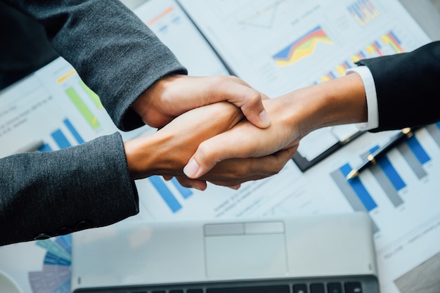 Concept of partnership - handshake business partners Successful team leader entrepreneurship .