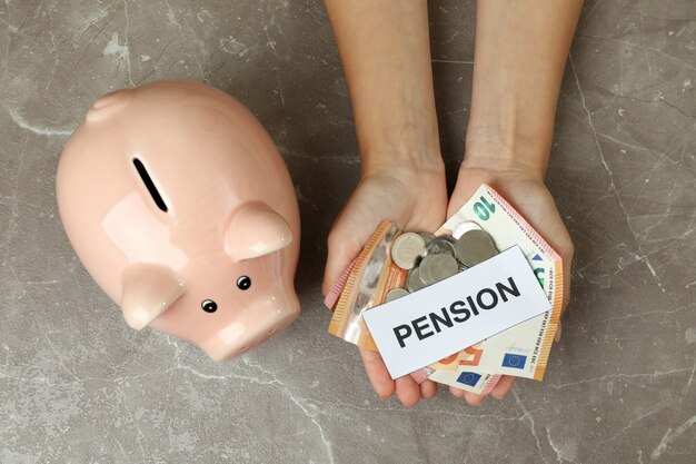 Photo concept of pension or retirement plan on gray table