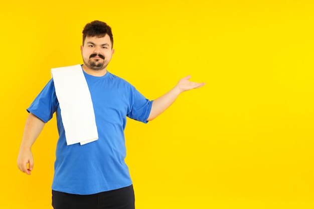 Concept of people young fat man on yellow background