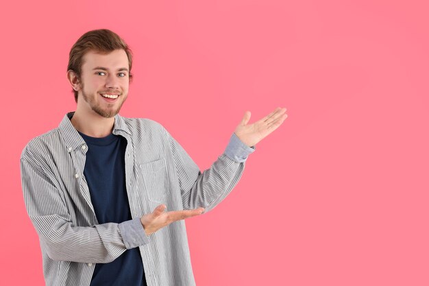 Concept of people young man on pink background