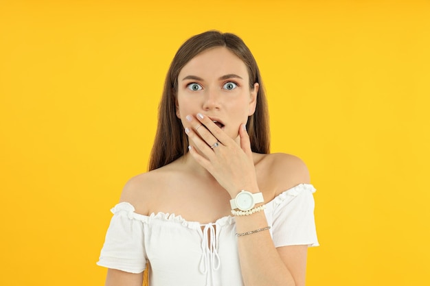 Concept of people young woman on yellow background