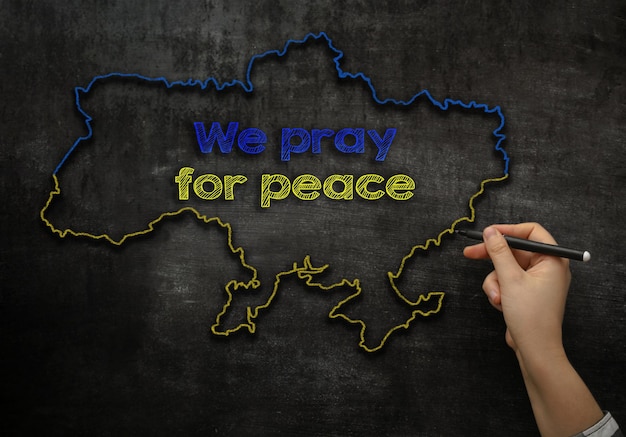 Concept photo in support of ukraine during the war we pray for peace