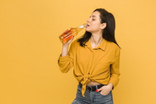 Concept photo of young female drinks beer, alcohol