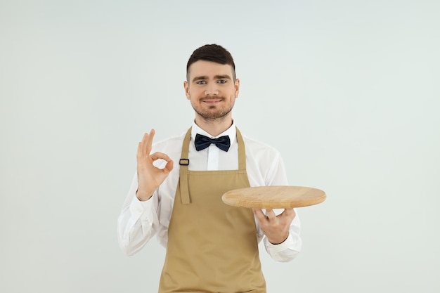 Concept of profession with young man waiter