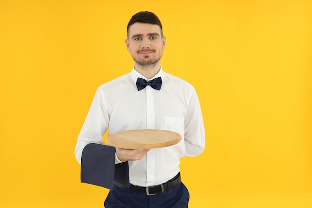 Concept of profession with young man waiter