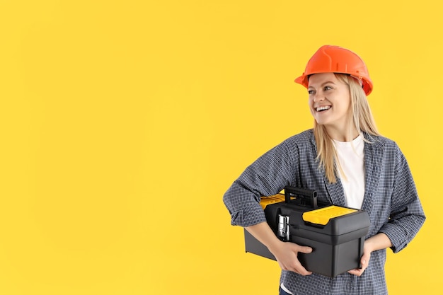 Concept of professions young woman on yellow background