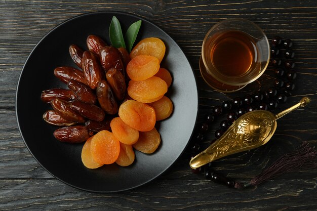 Concept of Ramadan with food and accessories on wooden table