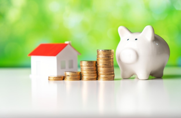 The concept of real estate,Piggy bank and house model