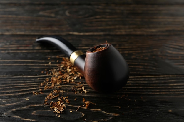 Concept of relaxing smoking pipe close up