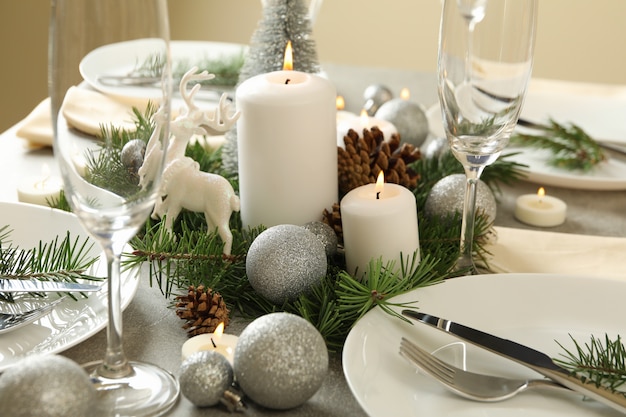 Concept of romantic New year table setting on gray table