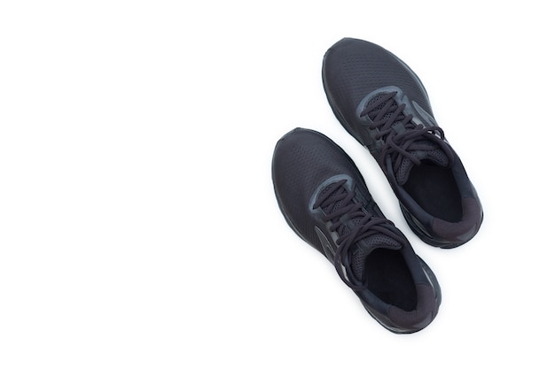 Concept run. Black running sneakers on a white background. Top view