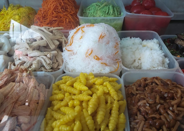 The concept of sale and nutrition pickled products in containers at a grocery kiosk