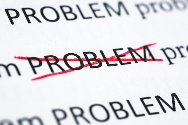 Concept of solving one of the problems. The word "Problem" printed on paper and crossed out with a red pen.