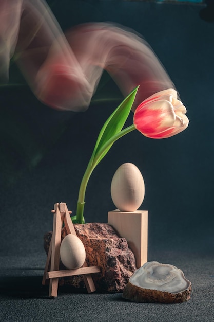 Concept spring freakebana redwhite tulip and Easter eggs easter concept