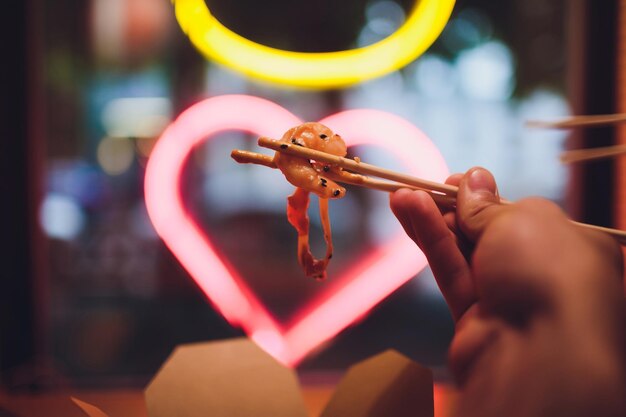 concept of street food chinese japanese noodles with chicken and vegetables in disposable paper