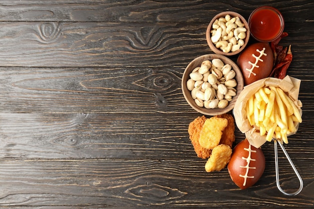 Concept of super bowl snacks on dark background