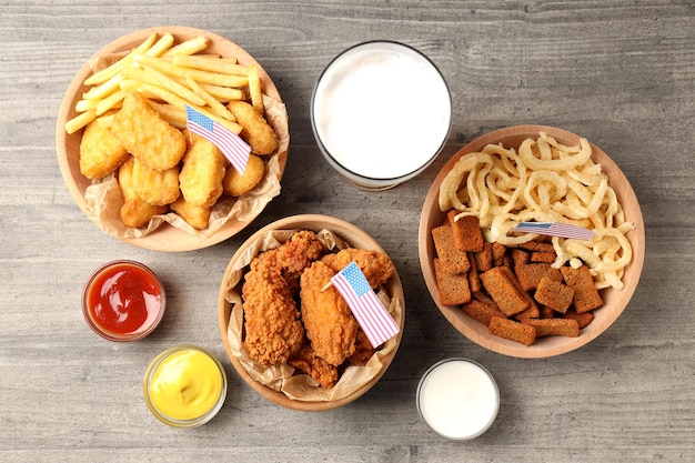 Concept of super bowl snacks on gray wooden background