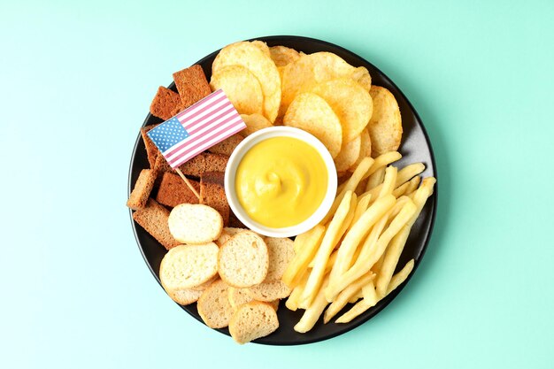 Photo concept of super bowl snacks on mint background