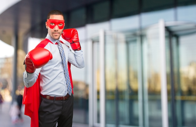 Photo concept of a super businessman fighting