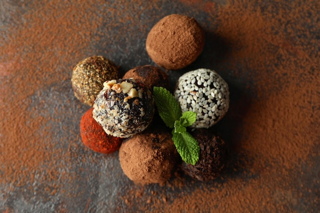 Concept of sweets with truffles on dark textured background