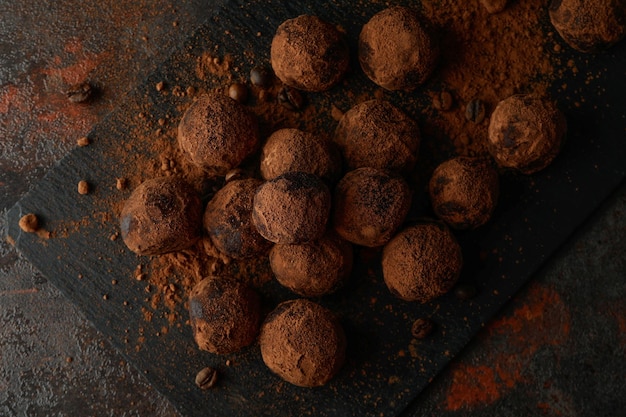 Concept of sweets with truffles on dark textured background