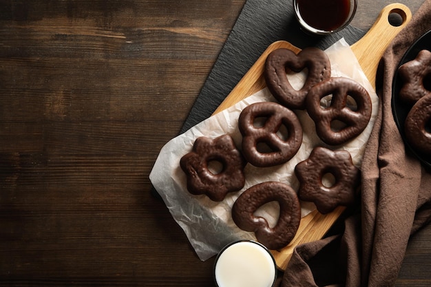 Concept of tasty bakery gingerbread cookies in chocolate space for text