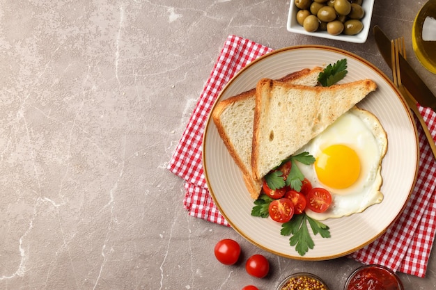 Concept of tasty breakfast on gray textured background