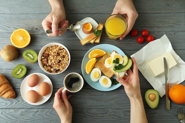 Concept of tasty breakfast on wooden background