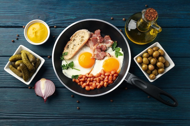 Concept of tasty breakfast on wooden background