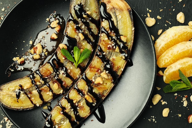 Concept of tasty dessert grilled banana close up