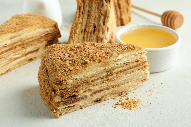 Concept of tasty dessert with honey cake close up