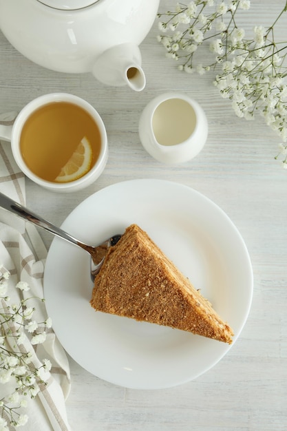 Concept of tasty dessert with honey cake, top view