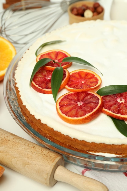 Concept of tasty dessert with meringue pie with citrus closeup