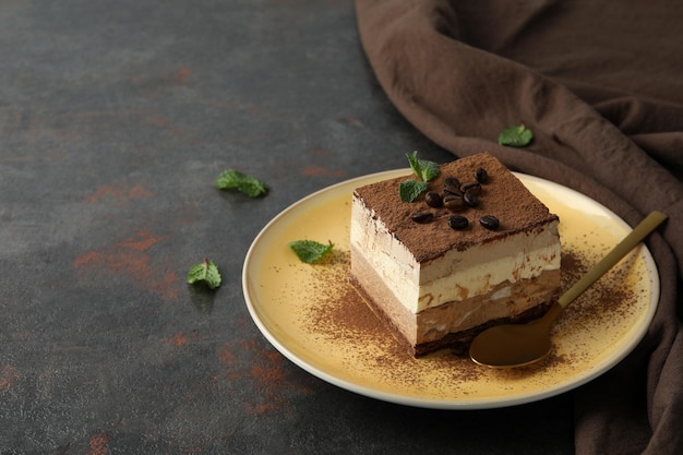 Photo concept of tasty dessert with tiramisu cake space for text