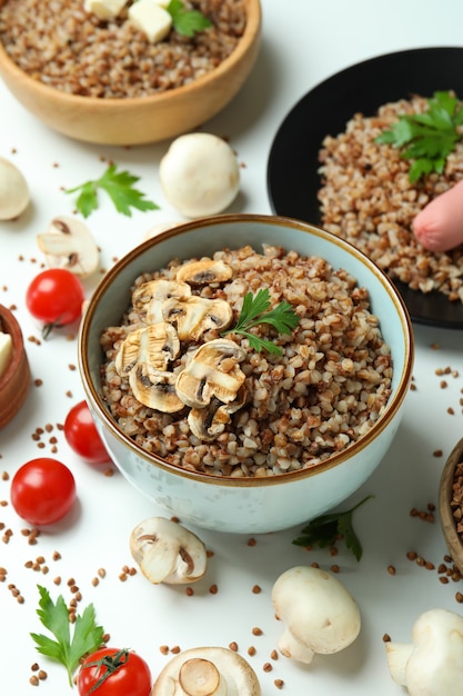 Concept of tasty eating with buckwheat on white