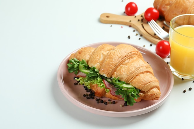 Concept of tasty eating with croissant sandwich