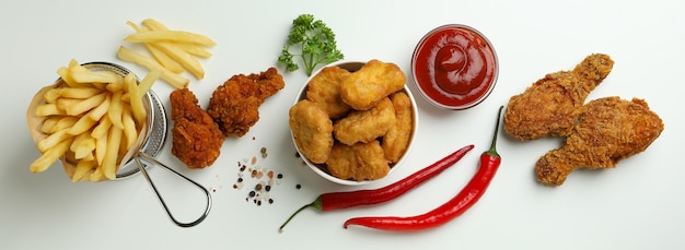 Concept of tasty eating with fried chicken on white background