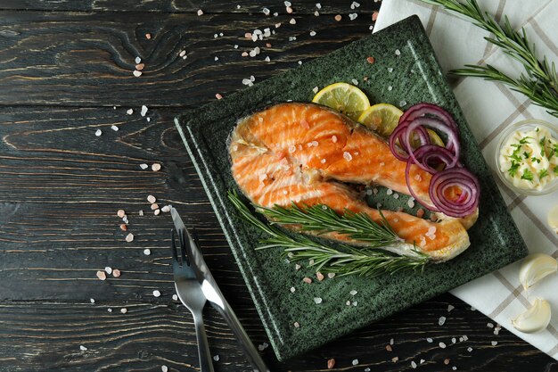 Concept of tasty eating with grilled salmon, space for text