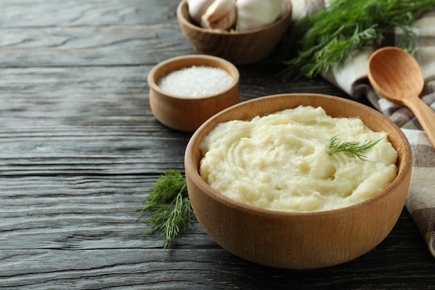 Concept of tasty eating with mashed potatoes on wooden table