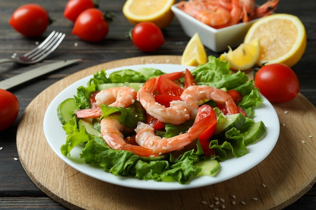 Concept of tasty eating with shrimp salad, close up