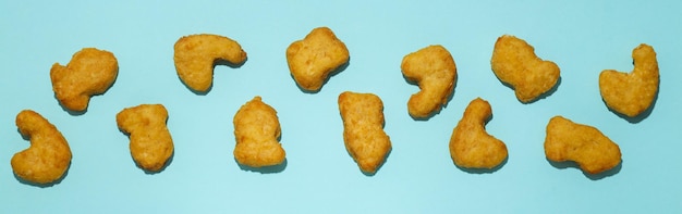 Concept of tasty fast food nuggets top view