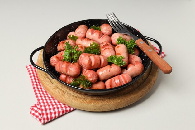 Concept of tasty food, grilled mini sausage