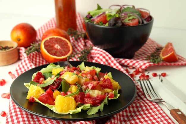 Concept of tasty food salad with red orange close up