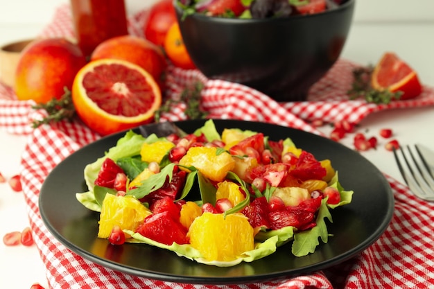 Concept of tasty food salad with red orange close up