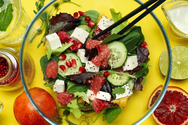 Concept of tasty food salad with red orange close up