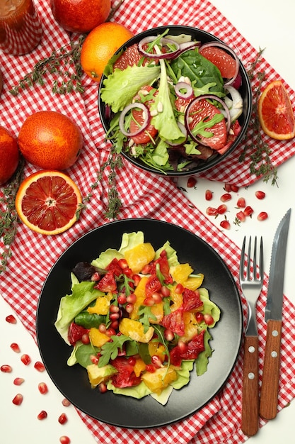 Concept of tasty food salad with red orange top view