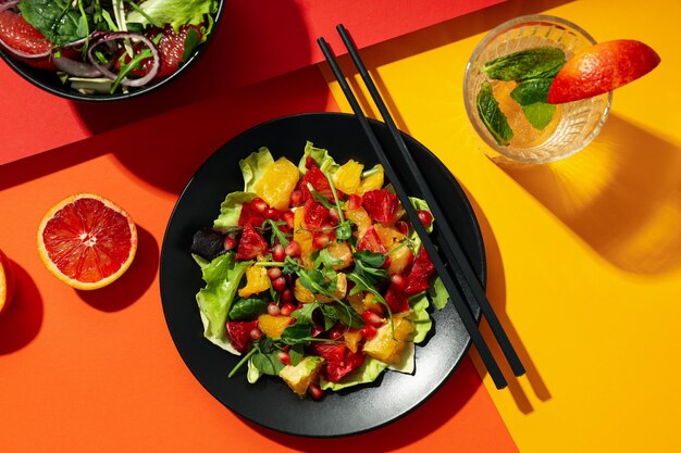 Concept of tasty food salad with red orange top view
