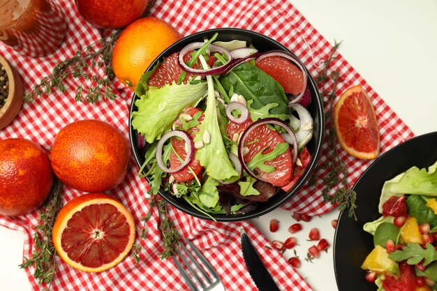 Concept of tasty food salad with red orange top view