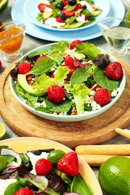 Concept of tasty food salad with strawberry